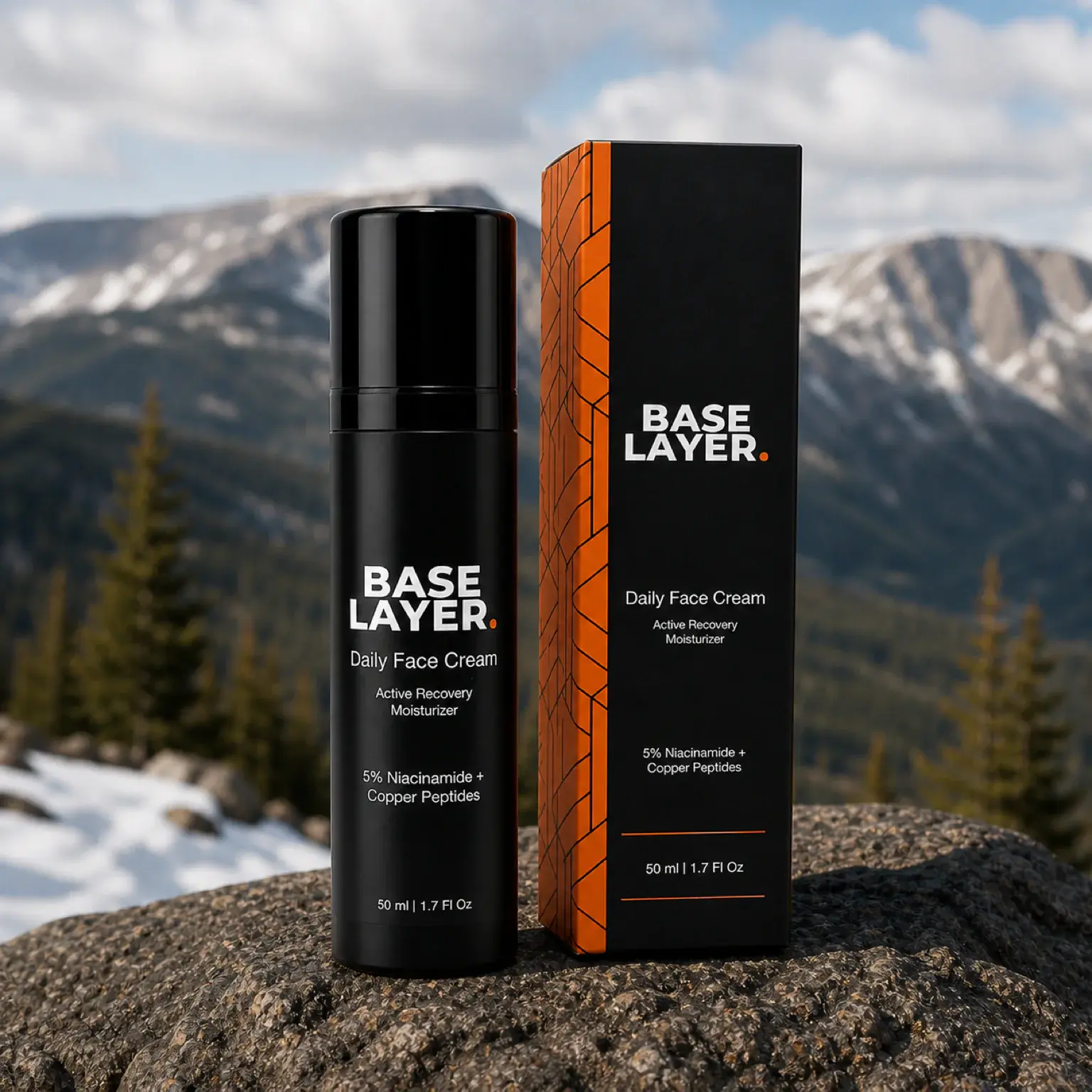 Base Layer Daily Face Cream bottle and carton on Colorado alpine granite